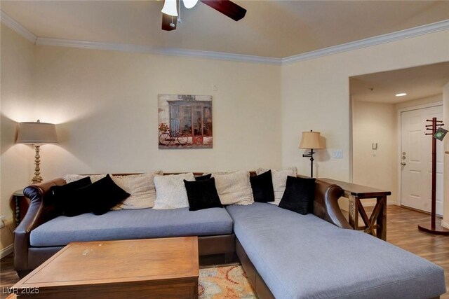 living room with ceiling fan, crown molding, and hardwood / wood-style flooring