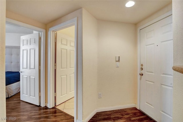 corridor featuring dark wood-type flooring