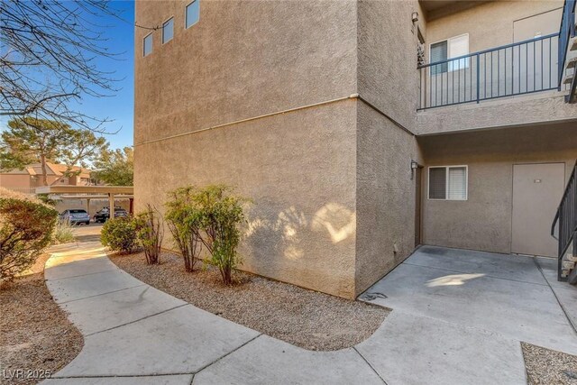 view of property exterior with a balcony