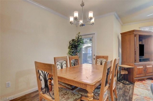 dining space featuring dark hardwood / wood-style floors, ornamental molding, and a notable chandelier