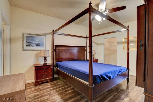 bedroom featuring ceiling fan and wood-type flooring