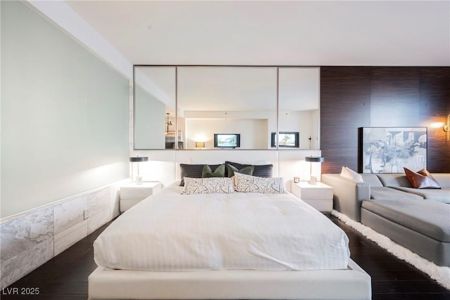 bedroom featuring dark hardwood / wood-style floors