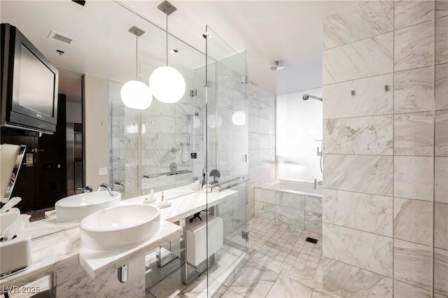 bathroom featuring tile walls and walk in shower