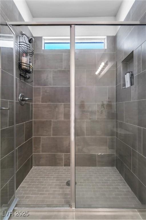 bathroom featuring a tile shower