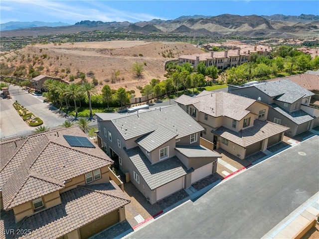 drone / aerial view featuring a mountain view