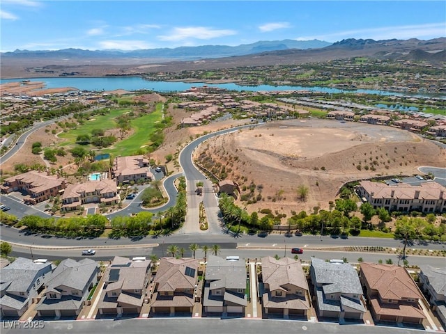 aerial view featuring a water and mountain view