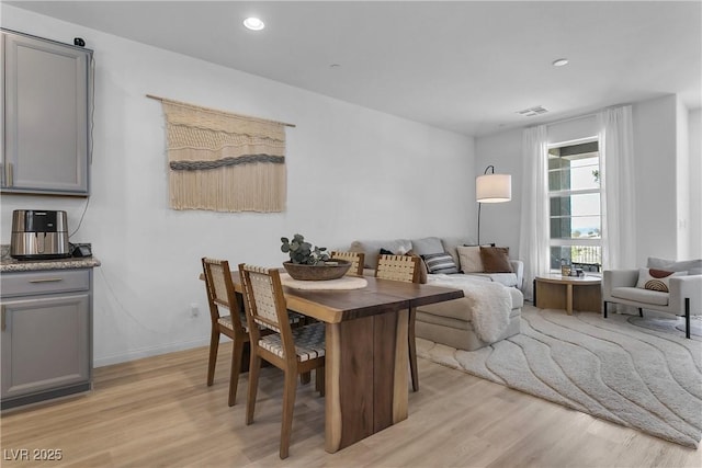 dining room featuring light hardwood / wood-style flooring