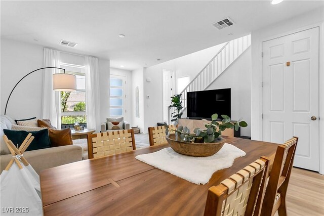 dining area featuring light wood-type flooring