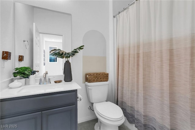 bathroom with toilet and vanity