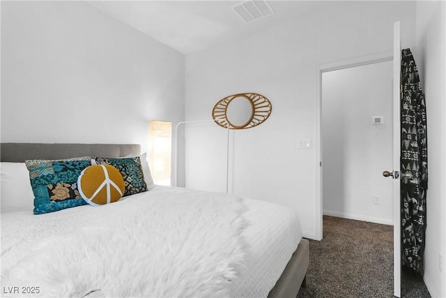 bedroom featuring dark colored carpet