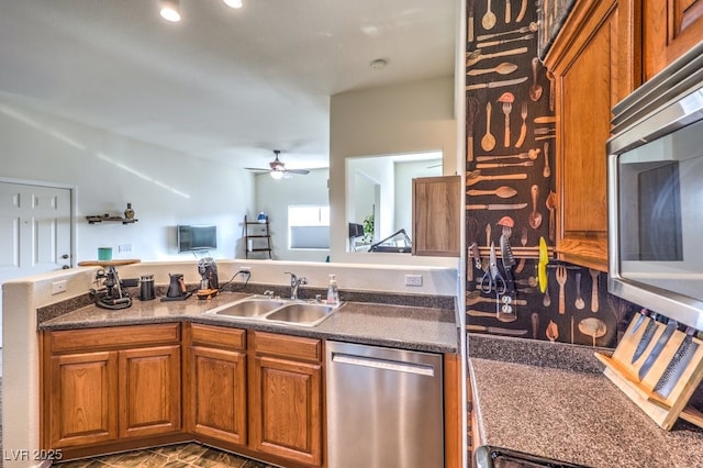 kitchen with ceiling fan, stainless steel appliances, and sink