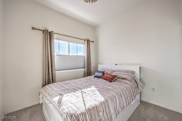 bedroom featuring light colored carpet