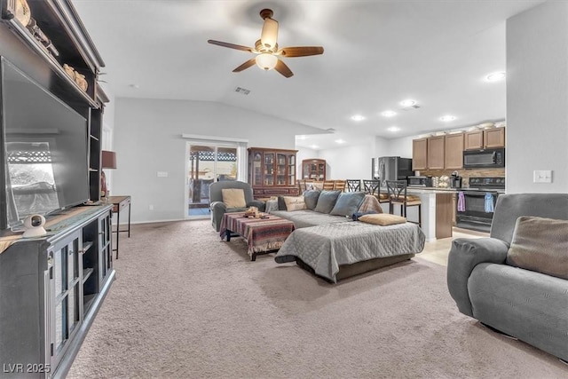 carpeted living room featuring vaulted ceiling and ceiling fan