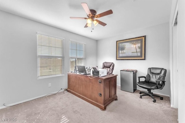 office space with light carpet and ceiling fan