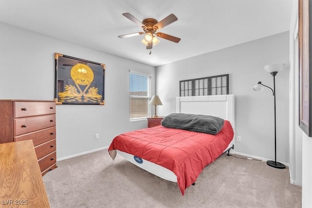 bedroom featuring ceiling fan and light carpet