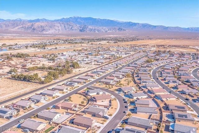 birds eye view of property with a mountain view