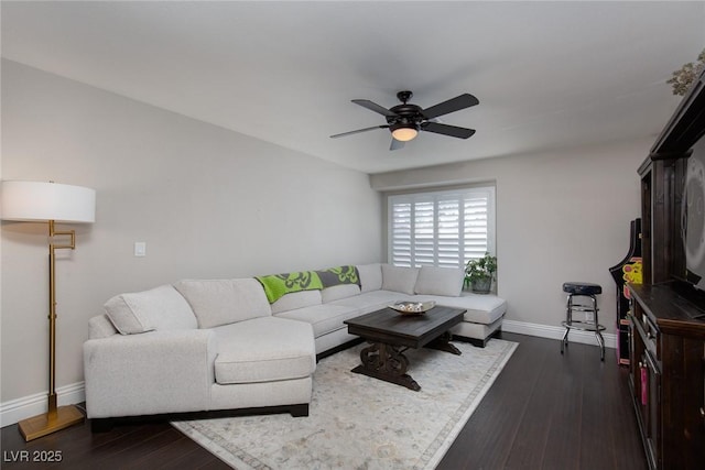 living room featuring dark hardwood / wood-style floors and ceiling fan