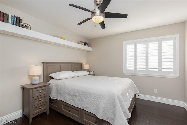 bedroom featuring dark hardwood / wood-style floors and ceiling fan