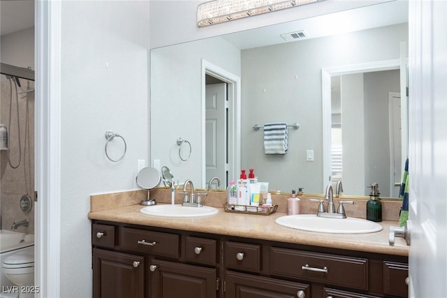 full bathroom with vanity, bathing tub / shower combination, and toilet