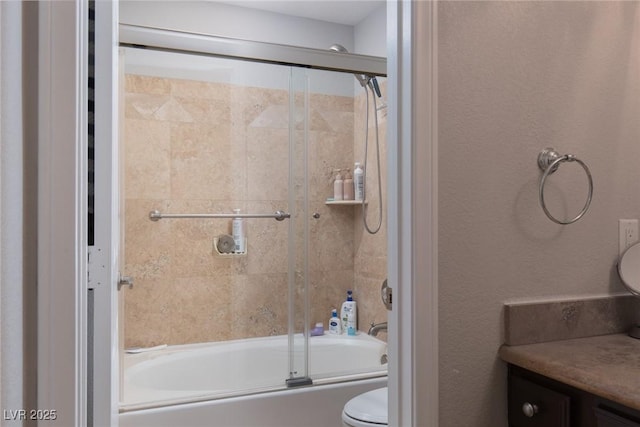 full bathroom with toilet, vanity, and shower / bath combination with glass door