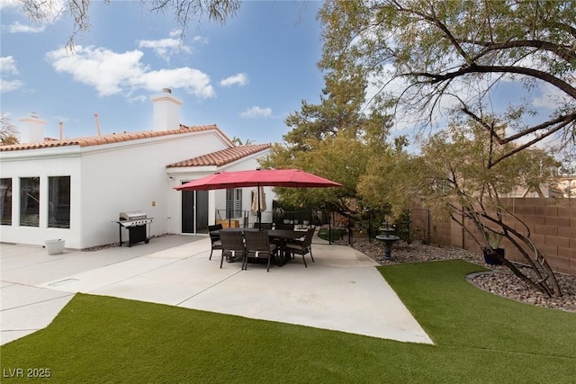 view of patio with a grill