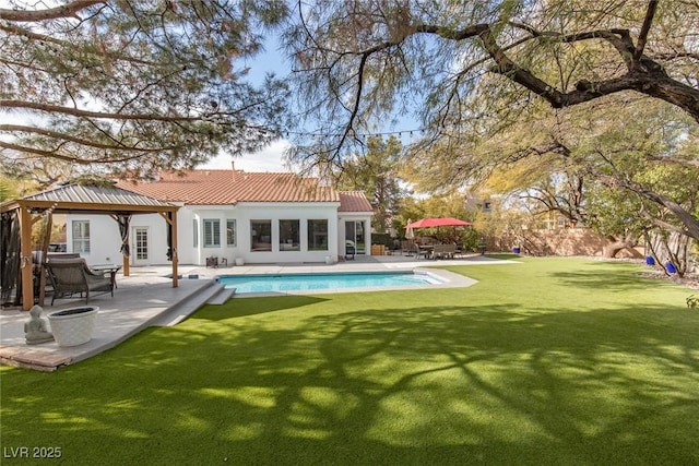 back of house with a gazebo, a patio area, and a lawn