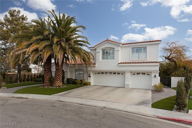 mediterranean / spanish home featuring a garage