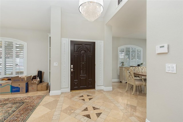 entryway with an inviting chandelier