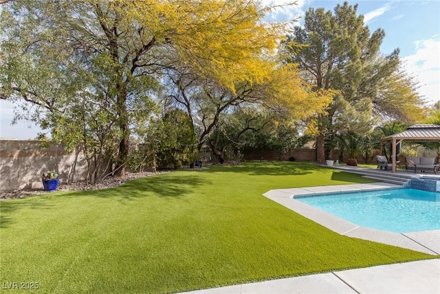 view of swimming pool with a gazebo and a lawn