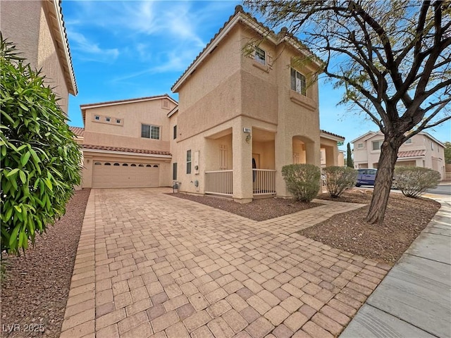 mediterranean / spanish-style home featuring a garage