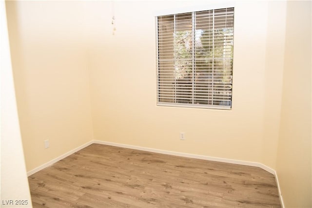 unfurnished room with wood-type flooring