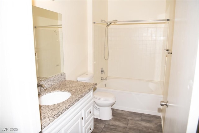 full bathroom featuring toilet, tub / shower combination, and vanity