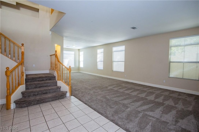 interior space featuring carpet floors and a wealth of natural light