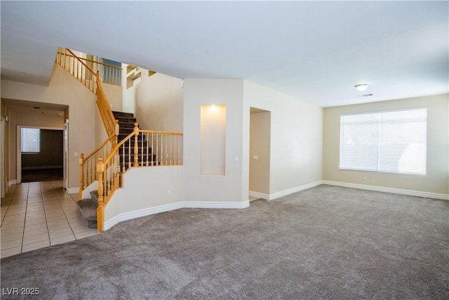 unfurnished living room with carpet flooring