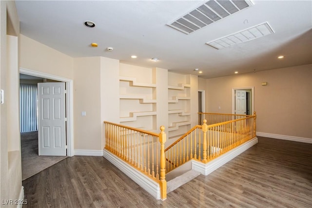 hallway with dark wood-type flooring