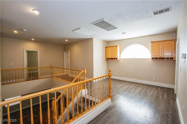 hallway with dark hardwood / wood-style floors