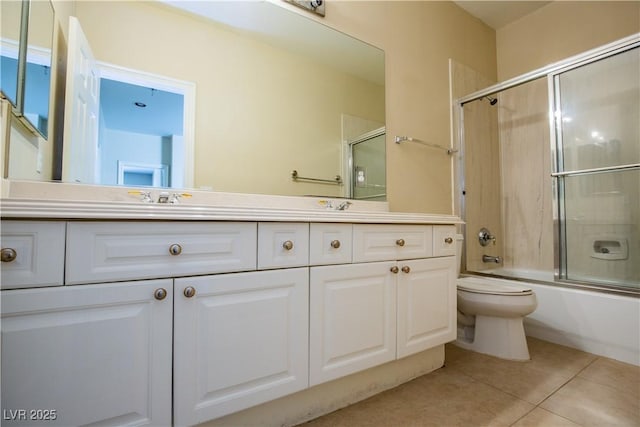 full bathroom with vanity, toilet, enclosed tub / shower combo, and tile patterned floors