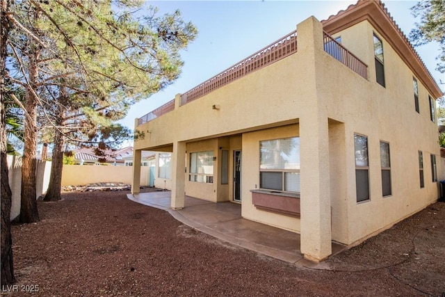 back of property with a patio area