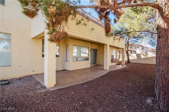 back of property featuring a patio area