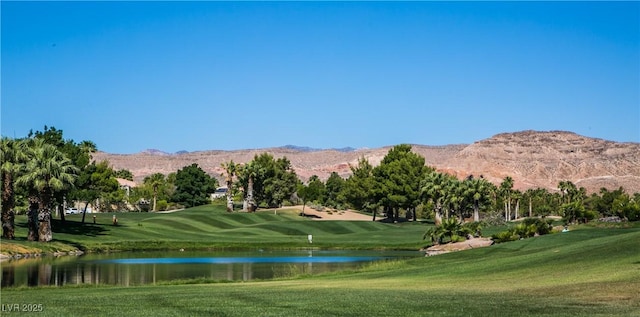 view of home's community featuring a yard and a water and mountain view