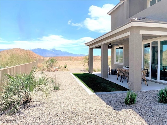 view of yard with a mountain view and a patio area