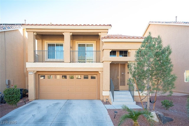 view of front of property with a tile roof, stucco siding, a balcony, a garage, and driveway