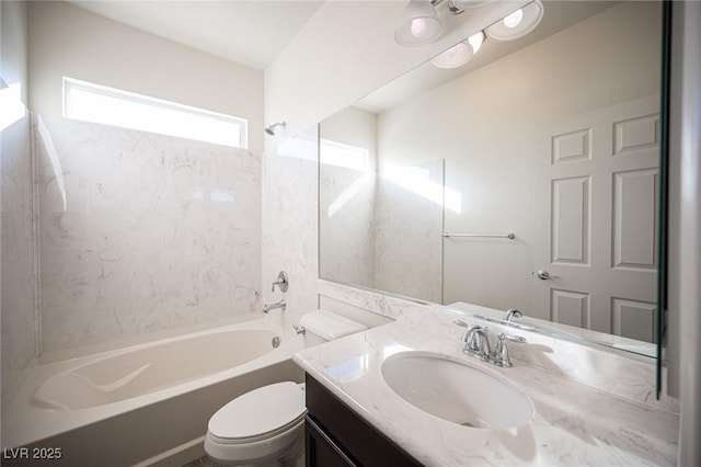 full bathroom featuring tub / shower combination, vanity, and toilet