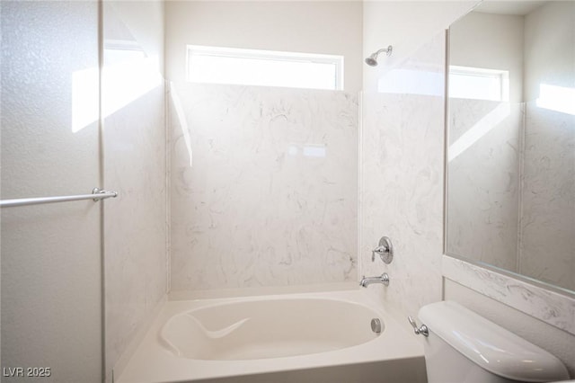 bathroom with shower / tub combination and toilet