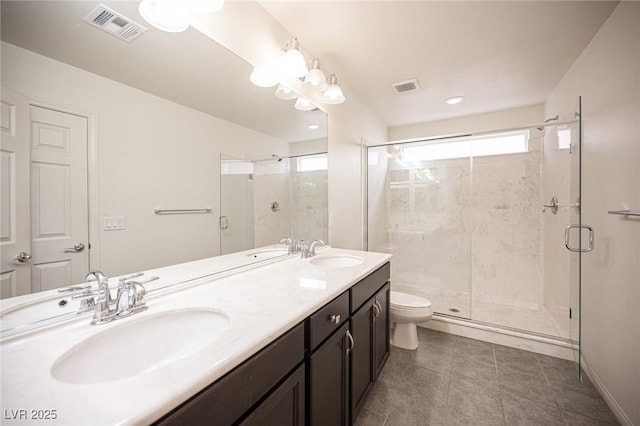 full bathroom with a shower stall, visible vents, and a sink