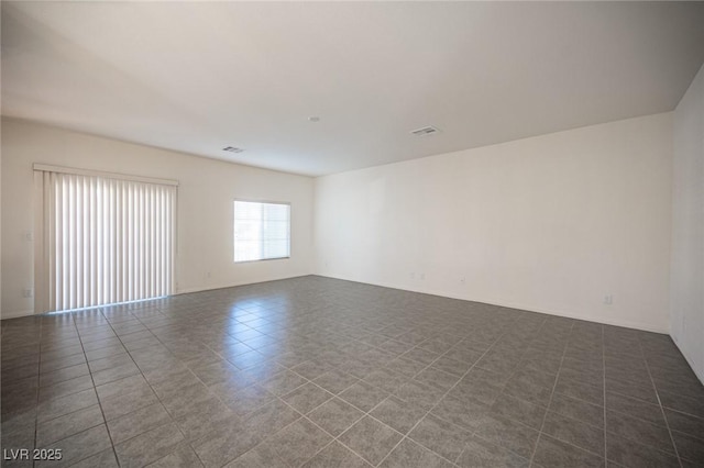 empty room featuring tile patterned floors