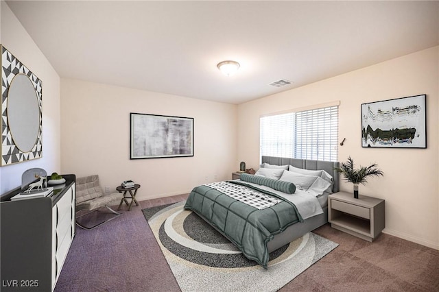 carpeted bedroom with visible vents and baseboards