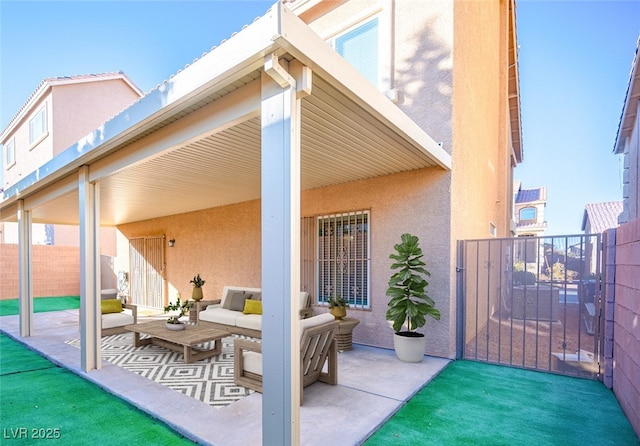 view of patio / terrace featuring fence and an outdoor hangout area