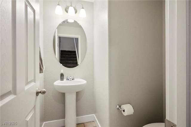 bathroom with tile patterned floors and toilet