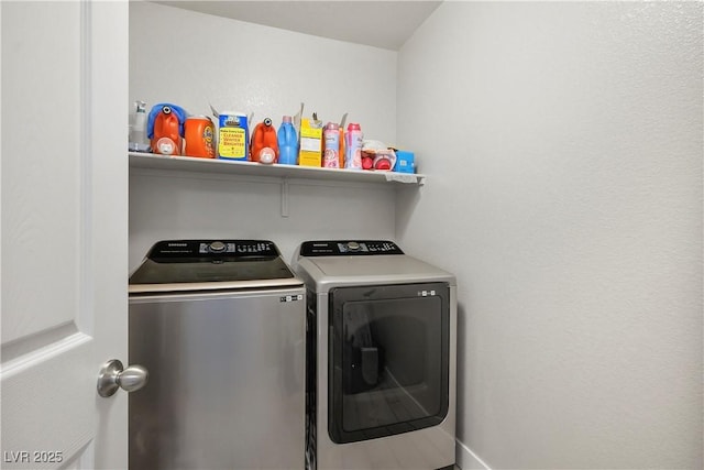 laundry area featuring washing machine and clothes dryer